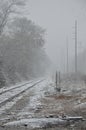 The Train tracks covered in snow during a snowstorm Royalty Free Stock Photo
