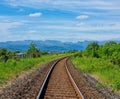 Train tracks curve into the distance in the Lake District, near Windermere Royalty Free Stock Photo