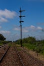 Train tracks deserted. Traffic signal