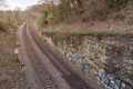 Train Tracks Through Forest from Above Horizon Sunset Curve Land Royalty Free Stock Photo