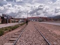 Train tracks and nearby bridge Royalty Free Stock Photo