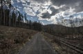 Train tracks next to forest path in Sazava river valley Royalty Free Stock Photo