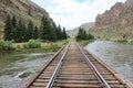 Train tracks running through the mountains Royalty Free Stock Photo