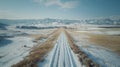 A train tracks running through a snowy landscape with mountains in the background, AI Royalty Free Stock Photo