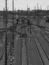 Train tracks and traffic lights in black and white Royalty Free Stock Photo