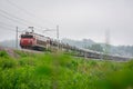 Train transporting automobiles. Long freight train with a large load of modern SUV cars. Transporting cars to the port of Koper