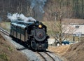 Train traveling along railroad tracks