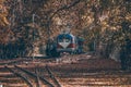 A train traveling deep into the forest. Old train on railway forest. Train coming in the autumn forest Royalty Free Stock Photo