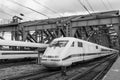 The train traveling to the Cologne central station through the Hohenzollern bridge in Cologne, Germany Royalty Free Stock Photo