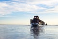 train travels from water. Mined salt in Lake Burlin. Altai. Russia. Bursolith. Old train rides on the railway laid in the water