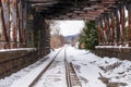A train tunnel with snow covered train tracks on a winter day Royalty Free Stock Photo