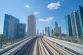 Train view on railway in Dubai Downtown at financial district, skyscraper buildings in urban city, UAE. Transportation for Royalty Free Stock Photo