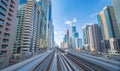 Train view on railway in Dubai Downtown at financial district, skyscraper buildings in urban city, UAE. Transportation for Royalty Free Stock Photo