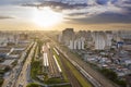 Train wagons next to Avenida Radial Leste at sunset, Tatuape neighborhood, Sao Paulo, Brazil