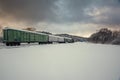 Train wagons in snowy winter landscape