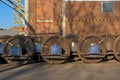 Train wheel sets in front of an industrial building Royalty Free Stock Photo