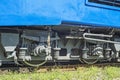 Train wheels on rail track. Wheels of a railway train on rails close up Royalty Free Stock Photo