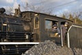 Train workers looking out of engine room Royalty Free Stock Photo