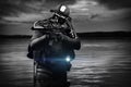 Trained commander of the Marines emerged with a scuba gear and moves to the target with weapons in his hands. The concept of video