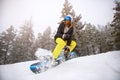 Snowboarder girl in action on ski-run Royalty Free Stock Photo