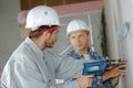 Trainee electricians learning their trade Royalty Free Stock Photo