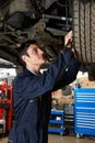 Trainee Mechanic Working Under Car Royalty Free Stock Photo