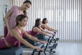A trainer adjusts women on a reformer. Royalty Free Stock Photo