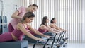 A trainer adjusts women on a reformer. Royalty Free Stock Photo