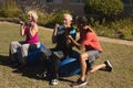 Trainer assisting senior man in performing exercise Royalty Free Stock Photo