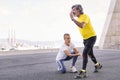 trainer correcting leg position of a sports man