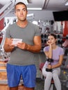 Trainer discussing workout plan with woman Royalty Free Stock Photo