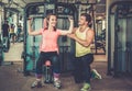 Trainer explaining how to use training machine Royalty Free Stock Photo