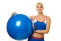 Trainer holding a fitness ball