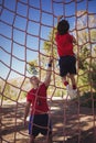 Trainer instructing boy during obstacle course training