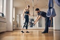 Trainer instructing a young lady before workout