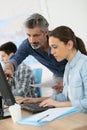 Trainer with interns working on computer Royalty Free Stock Photo