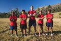 Trainer and kids standing with arms crossed in the boot camp Royalty Free Stock Photo