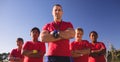 Trainer and kids standing together with arms crossed Royalty Free Stock Photo