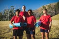 Trainer and kids standing together in the boot camp Royalty Free Stock Photo