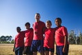 Trainer and kids standing together in the boot camp Royalty Free Stock Photo