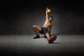 Trainer lying down with kettlebell on hand