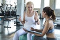 Trainer with senior woman exercise in gym. elderly healthy lifestyle and workout concept Royalty Free Stock Photo