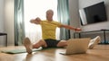 Trainer stretching a rubber band for sports