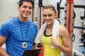 Trainer and woman discussing workout plan Royalty Free Stock Photo