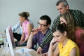 Trainer with young adults in a conference room Royalty Free Stock Photo