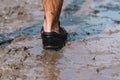 Training on bad weather. Running in rain, close up on shoes