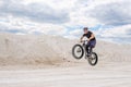 Training a bicyclist in a chalky quarry. A brutal man on a fat bike.