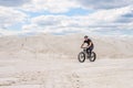 Training a bicyclist in a chalky quarry. A brutal man on a fat bike.