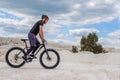 Training a bicyclist in a chalky quarry. A brutal man on a fat bike.