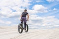 Training a bicyclist in a chalky quarry. A brutal man on a fat bike.